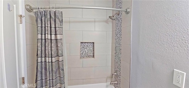 full bath featuring shower / tub combo with curtain and a textured wall