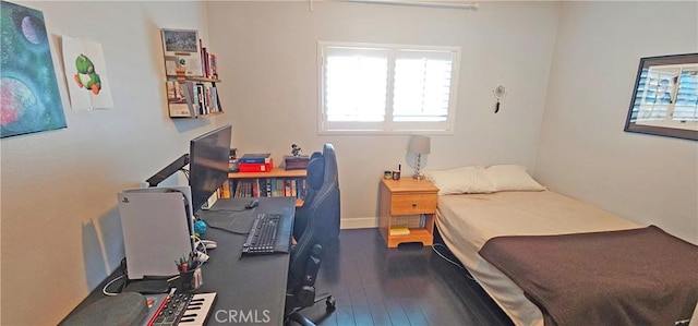 bedroom with wood-type flooring