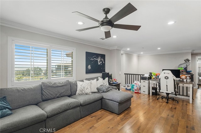 living area featuring visible vents, crown molding, recessed lighting, hardwood / wood-style flooring, and a ceiling fan