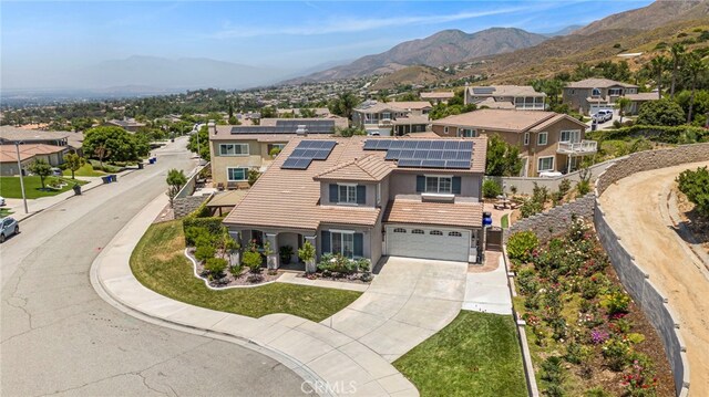 birds eye view of property with a residential view and a mountain view