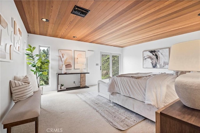 bedroom featuring visible vents, carpet flooring, and wood ceiling