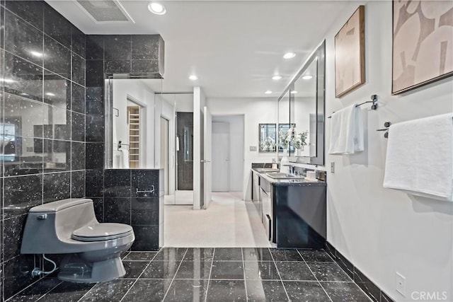 full bath featuring vanity, visible vents, recessed lighting, tile walls, and toilet