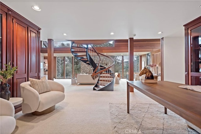 interior space with recessed lighting, plenty of natural light, and stairs