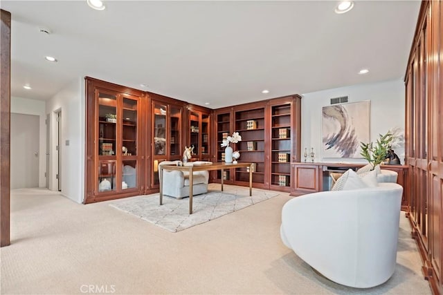 office space featuring recessed lighting, visible vents, and light carpet