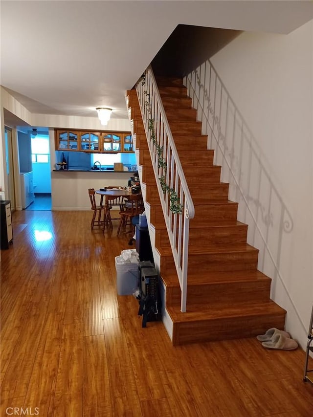 stairway with wood finished floors