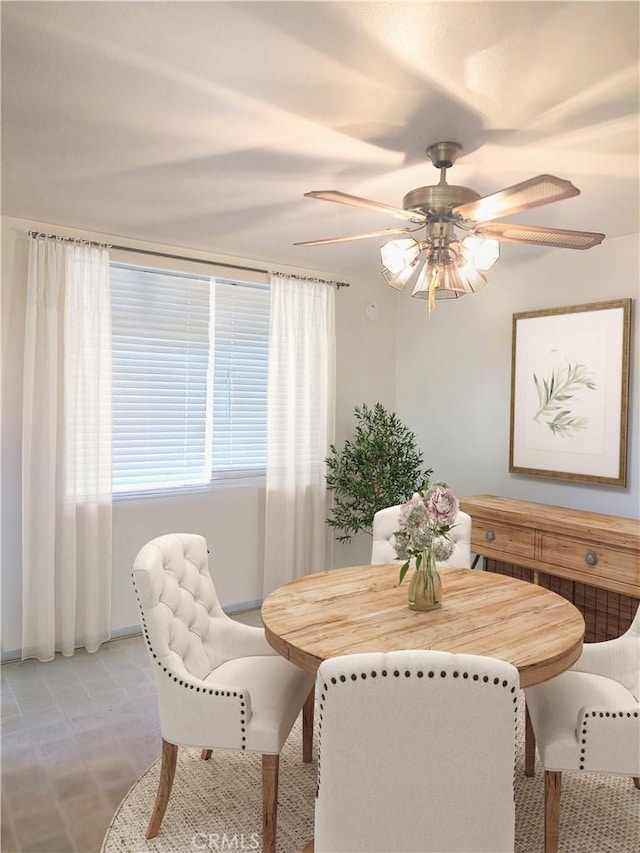 dining space with a ceiling fan