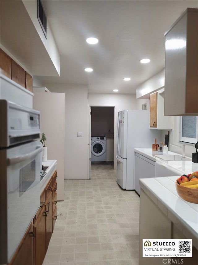 kitchen with recessed lighting, visible vents, tile countertops, and oven