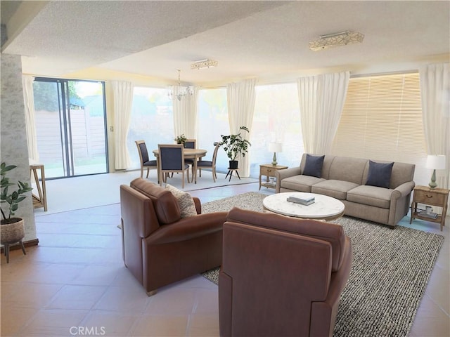 living area featuring a notable chandelier