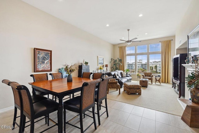 dining space featuring baseboards, light carpet, recessed lighting, light tile patterned flooring, and a ceiling fan