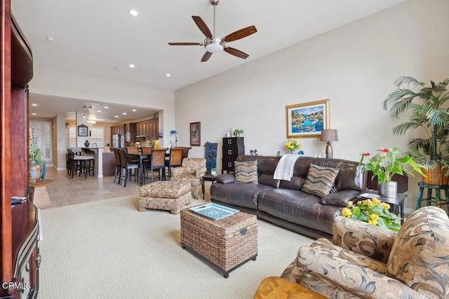 living area with recessed lighting, ceiling fan, and tile patterned flooring