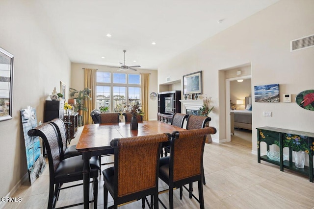 dining space featuring visible vents, recessed lighting, a fireplace, baseboards, and ceiling fan