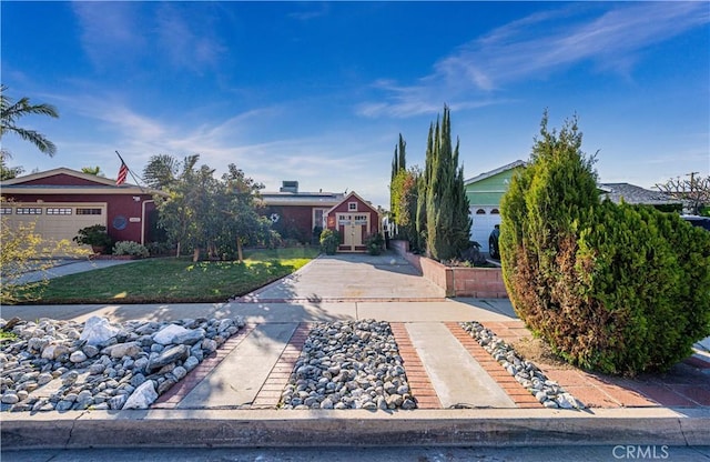 obstructed view of property featuring a front yard