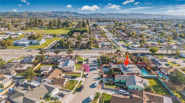 bird's eye view with a residential view and a mountain view