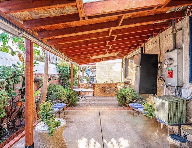 view of patio featuring fence