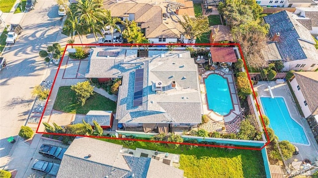 birds eye view of property with a residential view