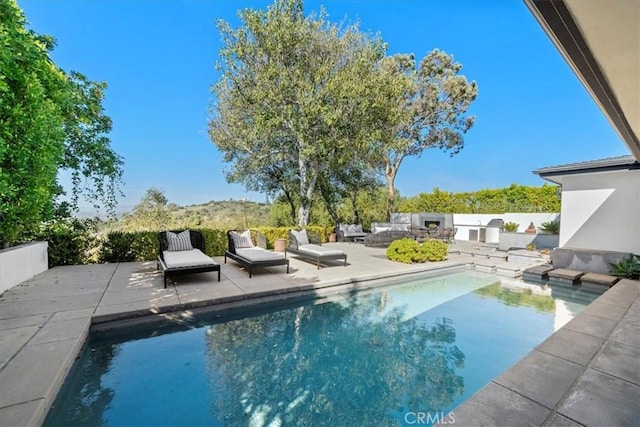 view of pool featuring a fenced in pool, a patio, and fence