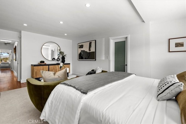 bedroom featuring recessed lighting, baseboards, and wood finished floors