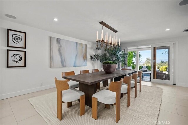 dining space with light tile patterned floors, a chandelier, recessed lighting, and baseboards