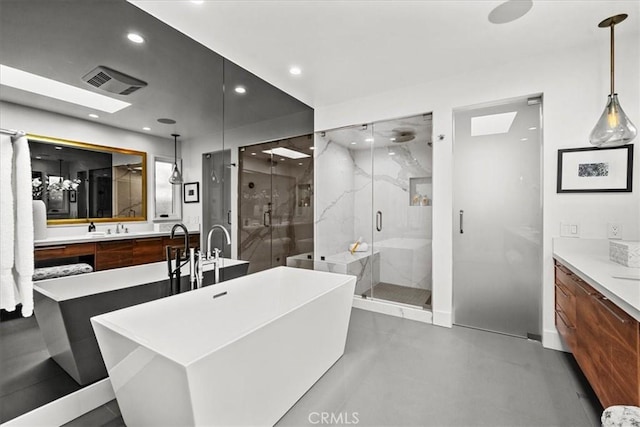 bathroom featuring visible vents, recessed lighting, a shower stall, a soaking tub, and vanity