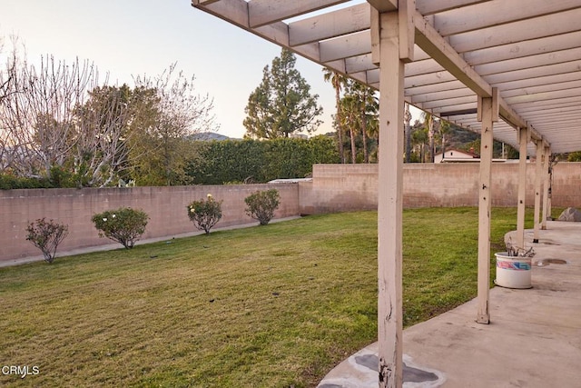 view of yard featuring a patio, a fenced backyard, and a pergola