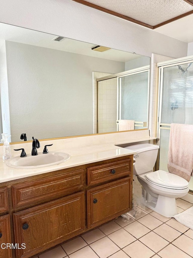 full bathroom with tile patterned flooring, visible vents, toilet, a stall shower, and vanity