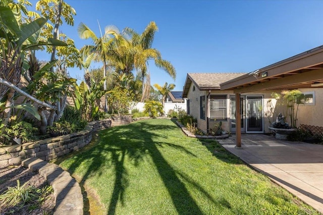 view of yard with a patio and fence