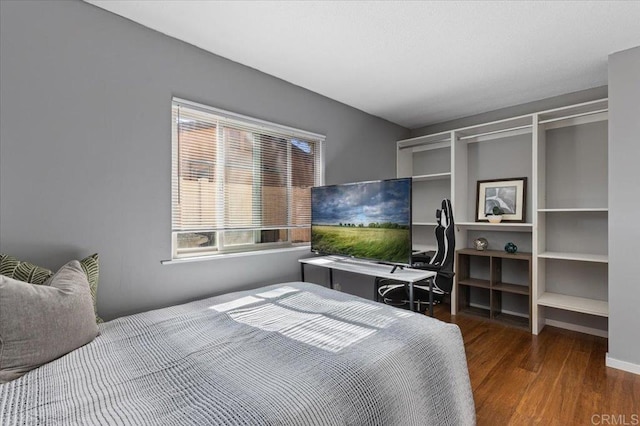 bedroom featuring wood finished floors