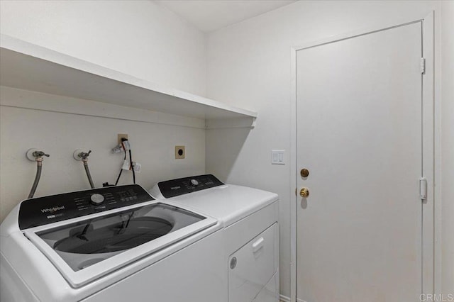 laundry room featuring washer and clothes dryer and laundry area