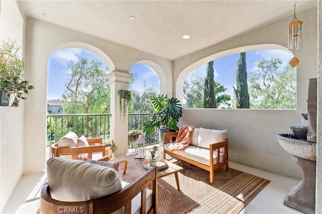 view of patio featuring outdoor lounge area and a balcony