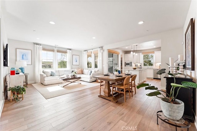 living area featuring recessed lighting and light wood finished floors