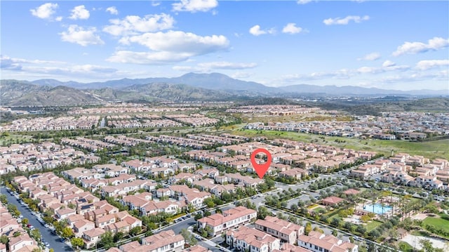 birds eye view of property with a mountain view and a residential view