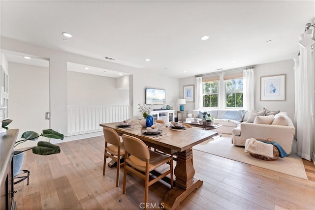 dining space with recessed lighting, visible vents, and light wood-style flooring