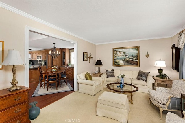 living area featuring a chandelier and crown molding