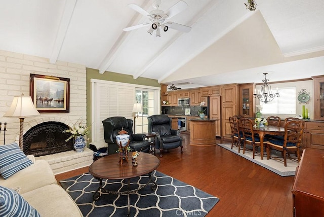 living room with dark wood-type flooring, plenty of natural light, a fireplace, and beam ceiling