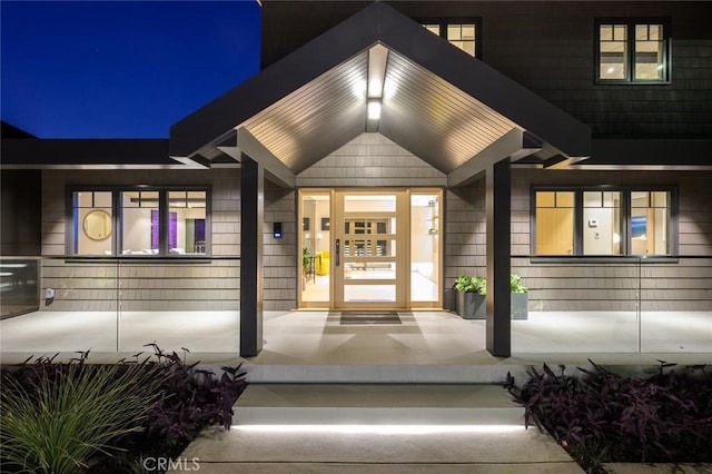 exterior entry at night with covered porch