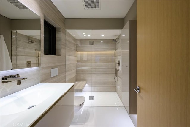 full bathroom featuring a shower stall, toilet, and visible vents