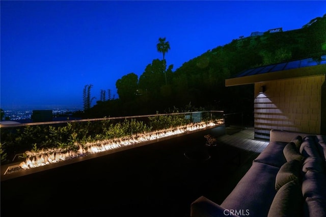 yard at night with a balcony