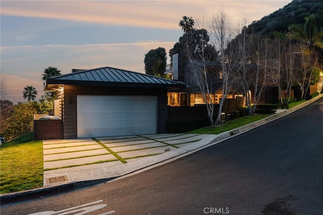 view of front of property featuring metal roof and a standing seam roof