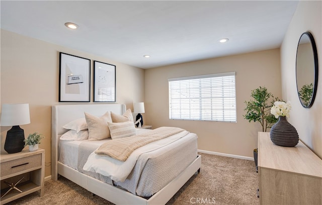 bedroom with recessed lighting, baseboards, and light colored carpet