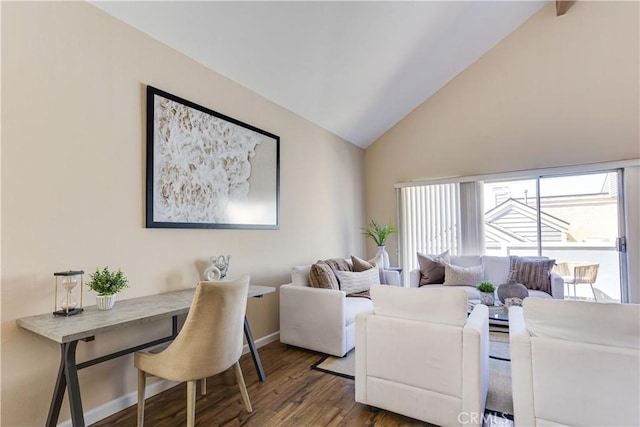 living room featuring baseboards, wood finished floors, and vaulted ceiling