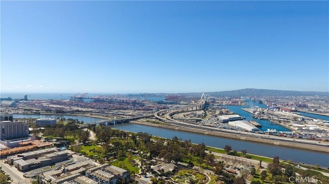 birds eye view of property with a water view and a city view