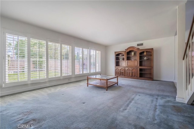 unfurnished living room with carpet