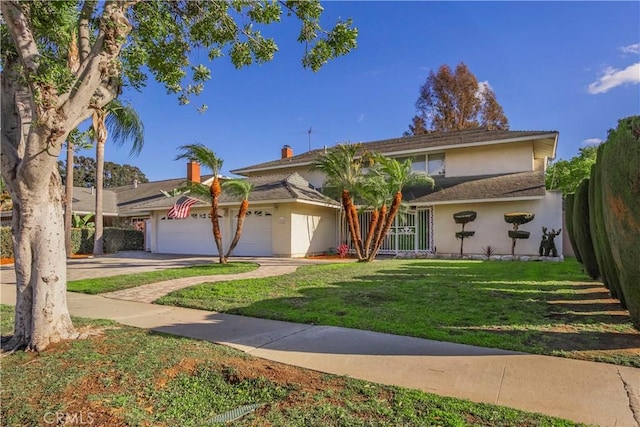 view of front of house featuring stucco siding, driveway, a front lawn, and a garage