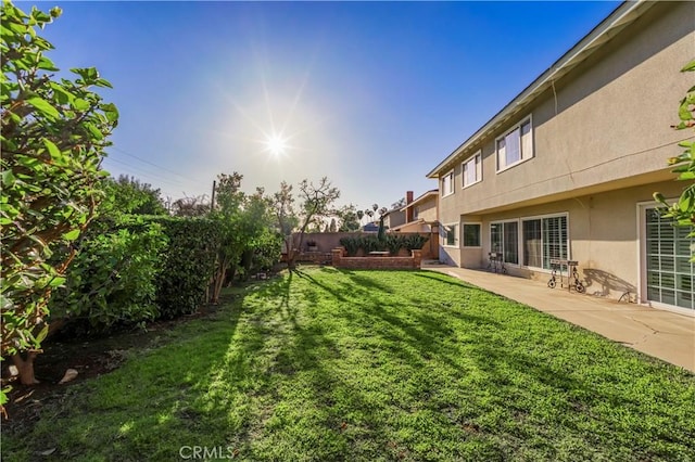 view of yard with a fenced backyard and a patio area