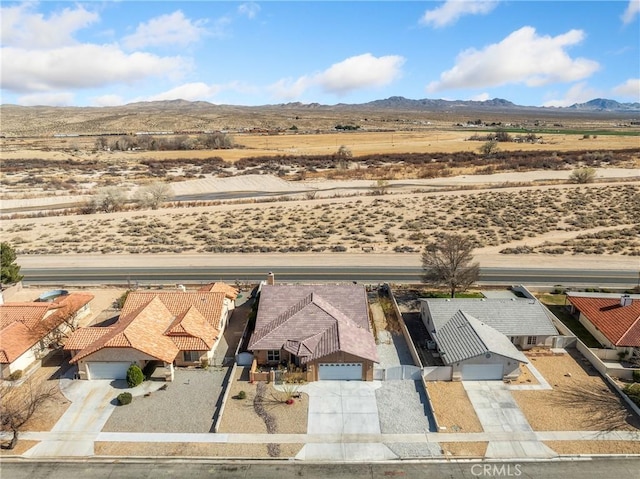 bird's eye view featuring a desert view and a mountain view