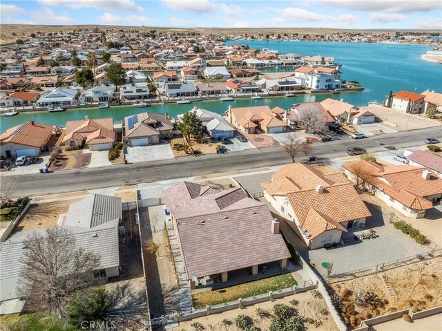 birds eye view of property with a residential view and a water view