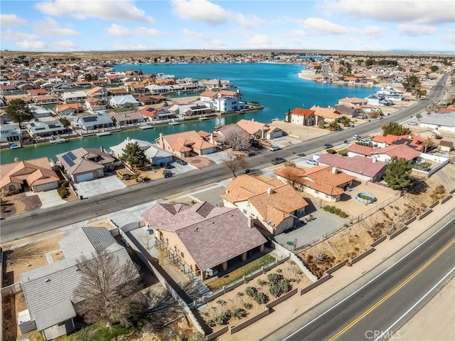 bird's eye view featuring a residential view and a water view