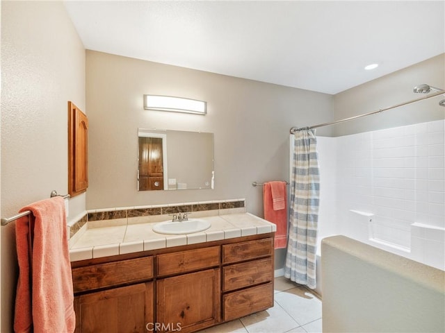 full bathroom with tile patterned flooring, shower / bath combination with curtain, and vanity