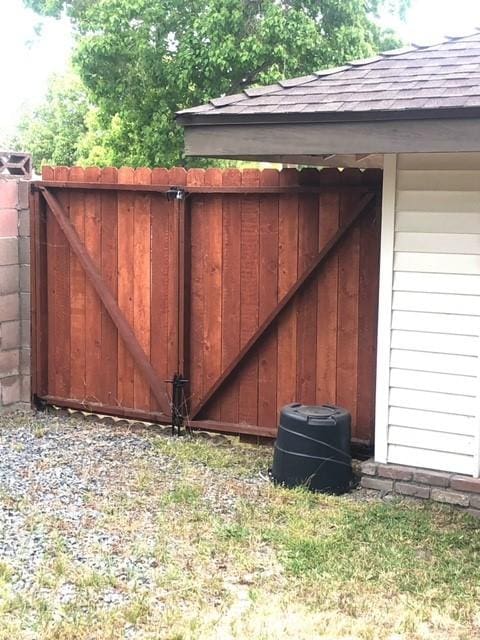 view of gate featuring fence