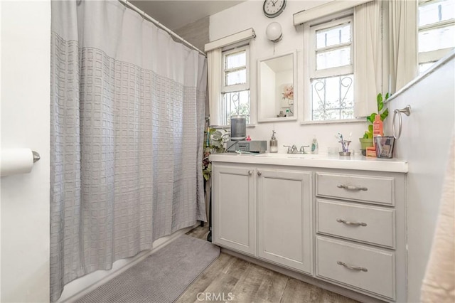 bathroom with vanity and wood finished floors